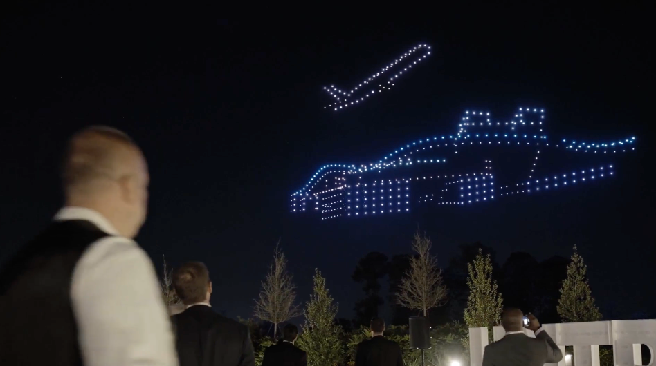 Picture of an airplane taking off from an airport during the HNTB drone light show at the Waldorf Astoria Hotel in Orlando