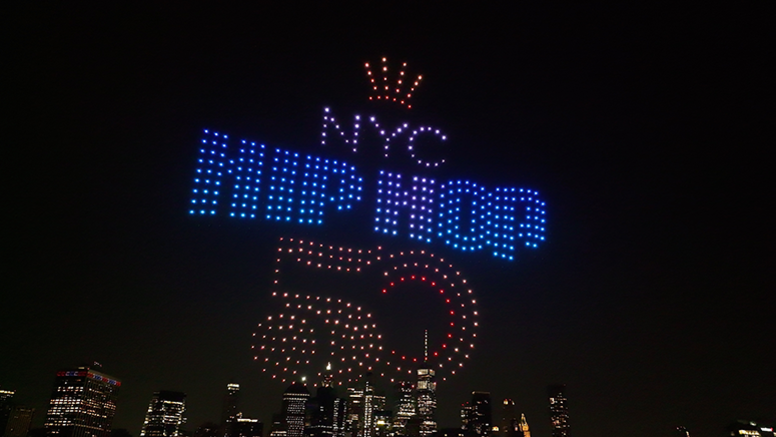 An image of a drone light show in New York City