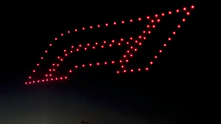 F1 racing logo in sky at COTA drone light show