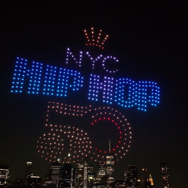The Hip Hop 50 logo in a drone light show over the Hudon River